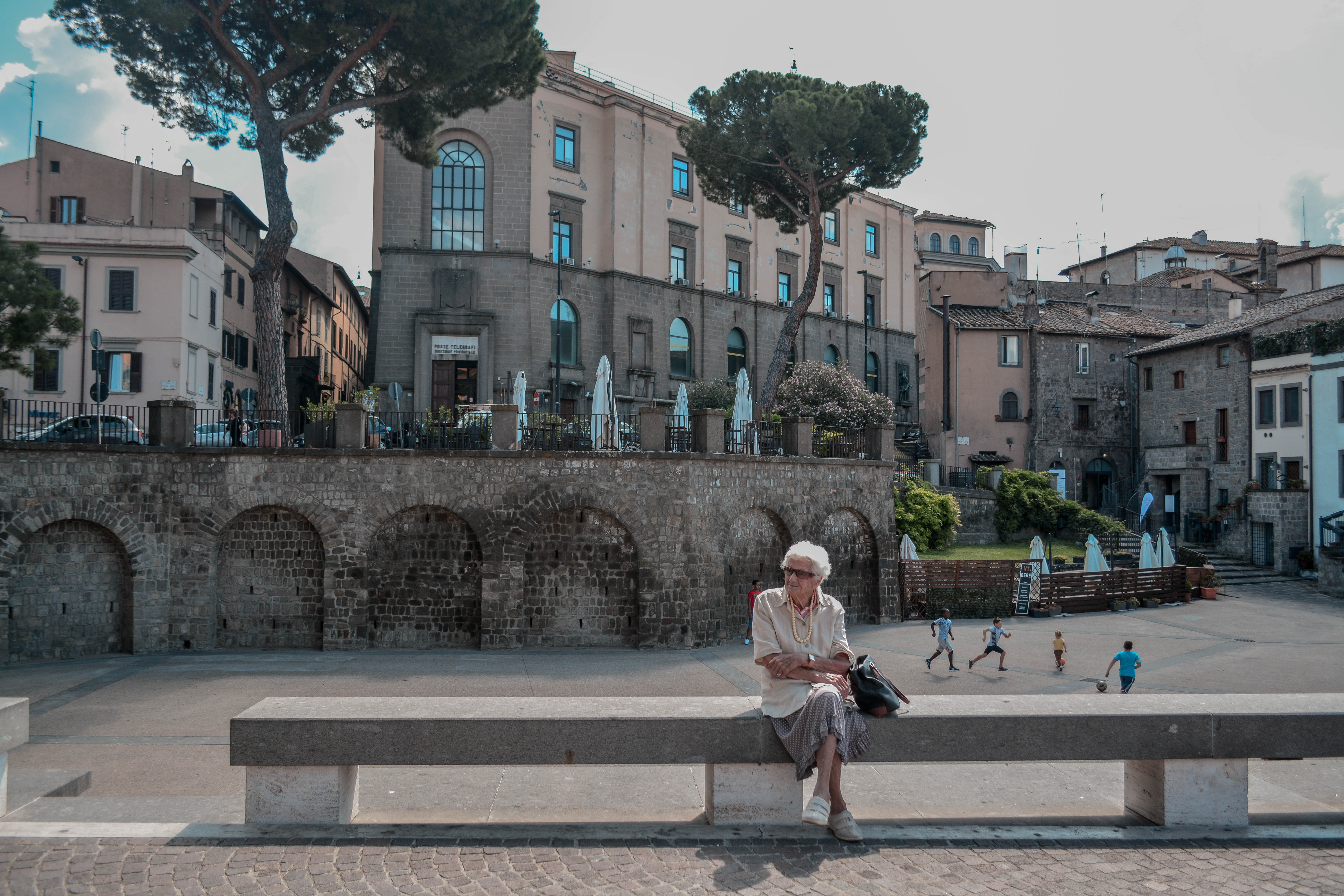 Italian mama sitting in Viterbo, 2019